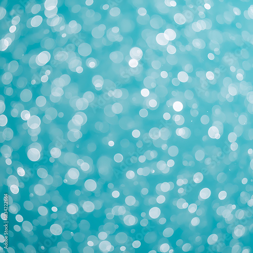 A vibrant abstract background of bokeh lights shimmering in a beautiful teal blue hue, creating a mesmerizing and dynamic visual effect