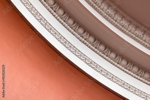 Intricate close-up of a beaded plaster ceiling molding
