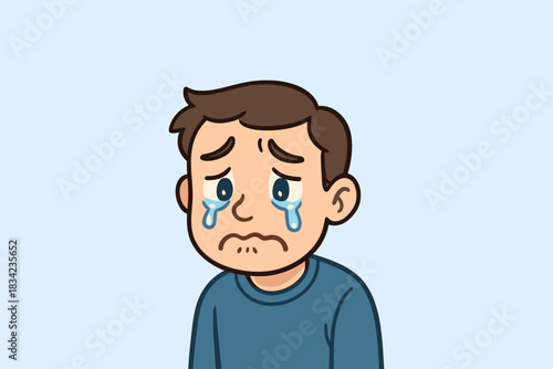 Sad boy with tears streaming down his cheeks. His expression conveys deep sorrow. Soft lighting adds a quiet emotional mood