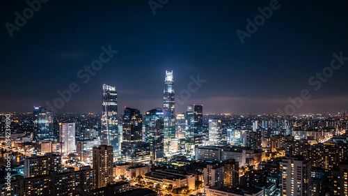 Wallpaper Mural A night shot captures a sprawling modern city's skyline with illuminated skyscrapers, twinkling stars, and an ambient twilight Torontodigital.ca