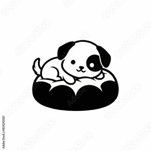 Cute puppy resting comfortably in its soft dog bed.