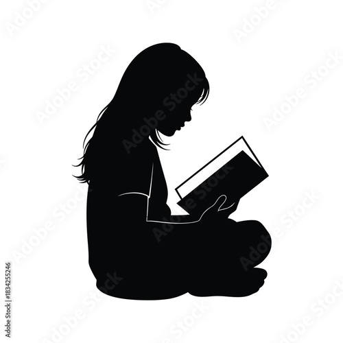 Silhouette of a Young Girl Reading a Book