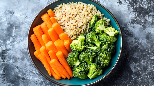 Healthy vegan buddha bowl with quinoa, broccoli, and carrot