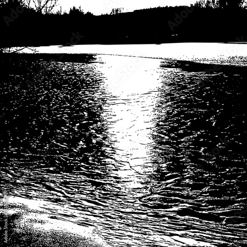 Monochrome River Scene Sunlight Reflecting on Waters Surface.