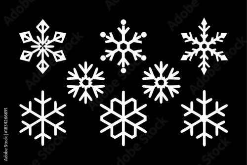 White snowflakes on black background for winter holiday season