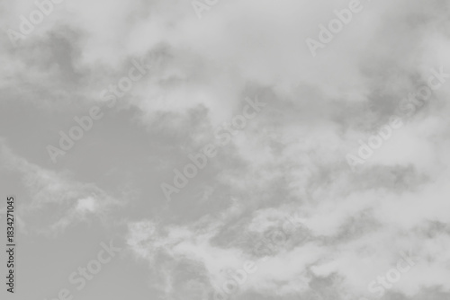 Cloud dancer toned sky and clouds. Monochrome background 2026 color of the year.