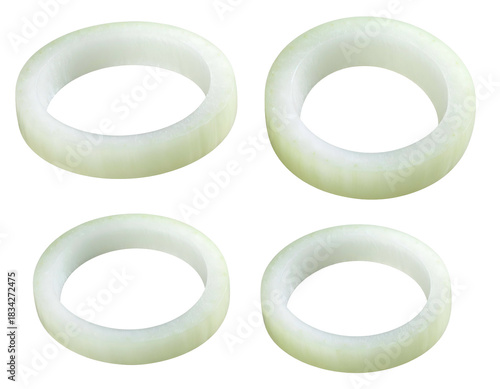 Four white and light green circular onion slices, black background