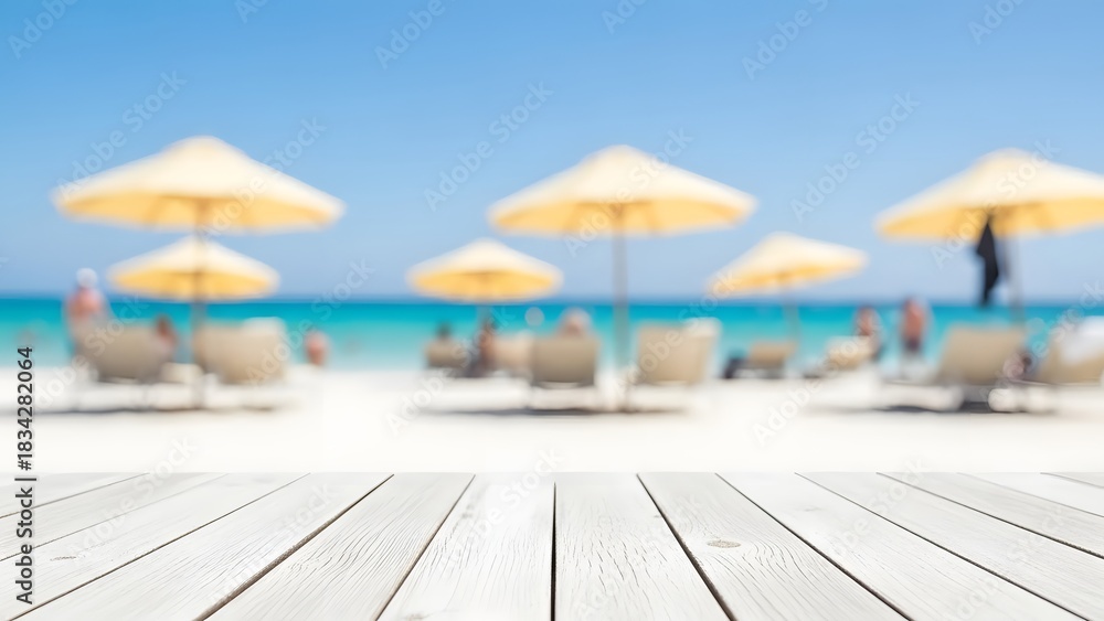 Obraz premium White wooden table with beach umbrellas and turquoise ocean background