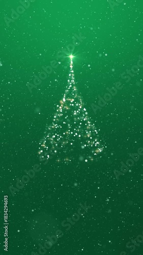 Christmas Tree Green Vertical Loop. Christmas tree made of sparkles with green background and snowfall, vertical resolution, seamless loop.
