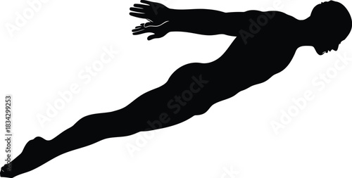 Silhouette of a man diving or swimming
