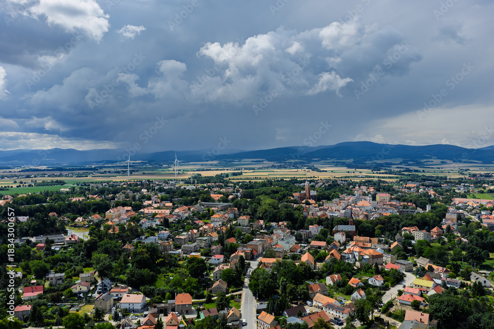 Fototapeta premium Aerial drone view of Paczkow. A city in the Opole province, in Nysa county, urban rural commune of Paczkow. Panorama of the city of Paczkow and Paczkowski Reservoir from a drone flight