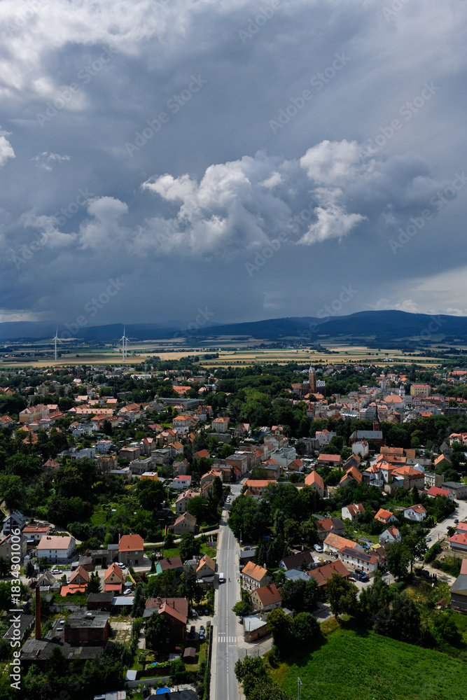 Obraz premium Aerial drone view of Paczkow. A city in the Opole province, in Nysa county, urban rural commune of Paczkow. Panorama of the city of Paczkow and Paczkowski Reservoir from a drone flight