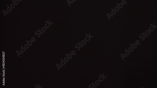 Dark grunge texture with black smoke and red flame explosion transition for an abstract movie opening