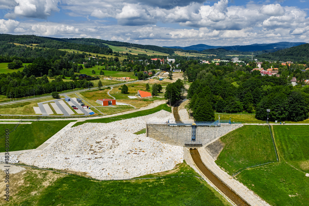 Fototapeta premium Aerial drone view of Stronie Slaskie town in Klodzko County Poland with scenic dam panorama. Stronie Slaskie city