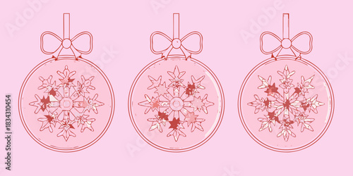 Three pink christmas ornaments with snowflakes and bows