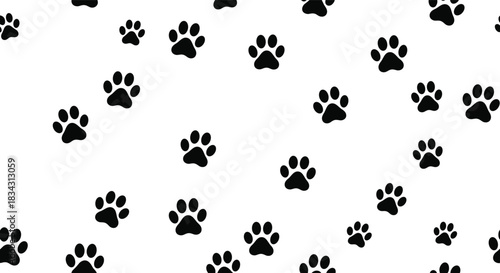 Fun seamless vector pattern featuring scattered black animal paw prints of various sizes, ideal for pet store backgrounds, veterinarian concepts, dog walking, and general animal theme designs