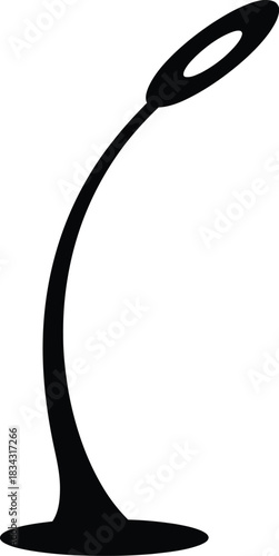 Minimalist black silhouette of a modern curved desk lamp with an oval light source