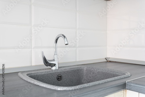 kitchen faucet on a stylish metal sink