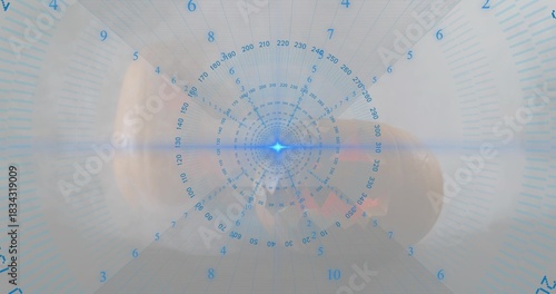 Holding adult hand presenting capsule at lab, with circular HUD and blue star, showing cuff