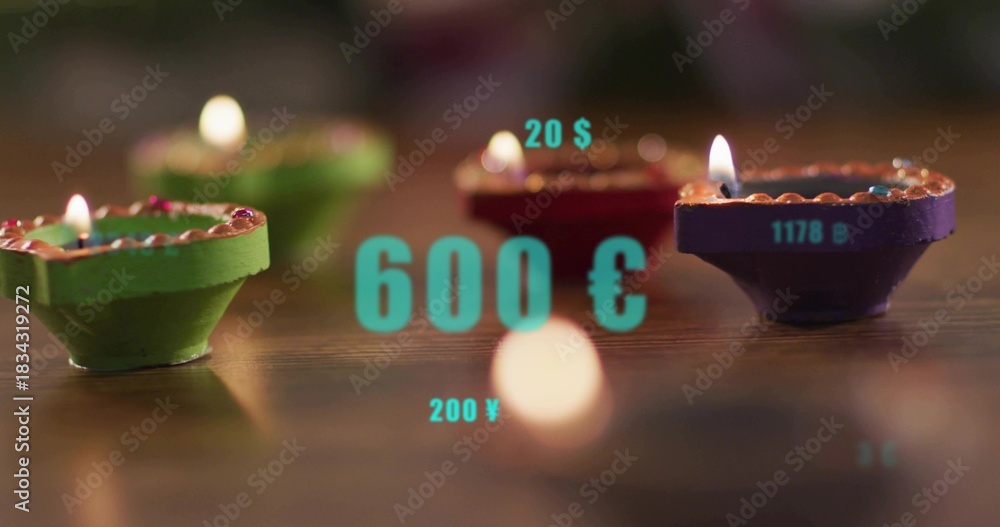 Fototapeta Flickering painted diyas showing flames on polished wood table, circular bokeh, turquoise overlays