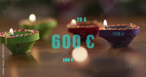 Fototapeta samoprzylepna Flickering painted diyas showing flames on polished wood table, circular bokeh, turquoise overlays