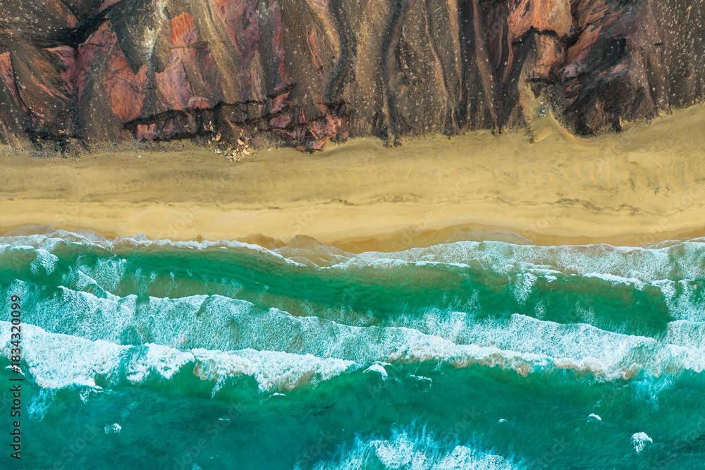 Naklejka premium The Playa Larga is located in the southern part of the Jandía peninsula in Fuerteventura and is a wild and sprawling stretch of coastline, roughly 1.5 kilometers long