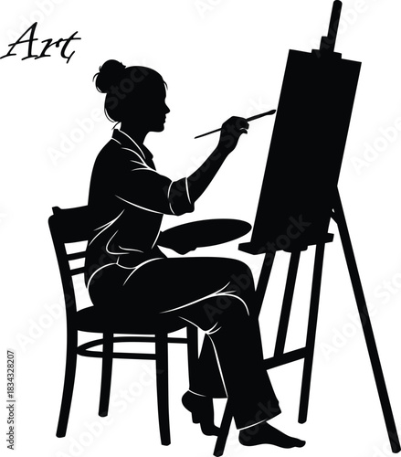 Silhouette of artist painting on canvas at easel