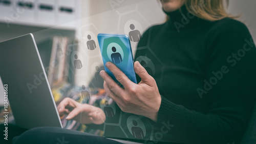 Woman uses laptop and mobile phone to network. Digital connections, online remote collaboration.