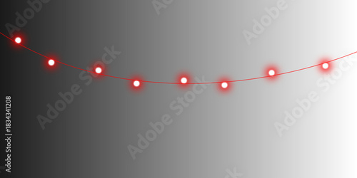 A minimalist string of glowing red lights hangs in a gentle curve against a dark to light grey gradient background.