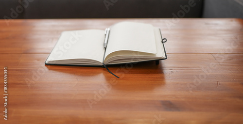 Notebook and Pen on Rustic Wooden Surface