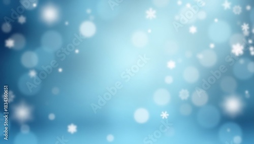 Blue abstract blurred winter background with falling snowflakes and bokeh.