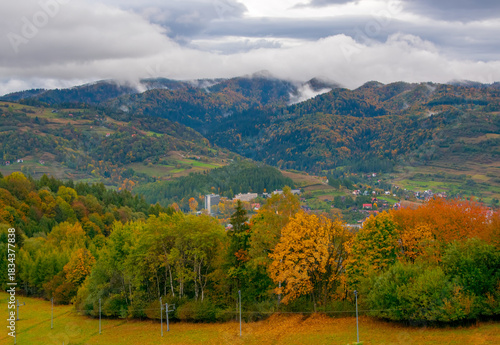Fototapeta Naklejka Na Ścianę i Meble -  Scenic autumn view of Pieniny mountains and Szczawnica spa resort from Ski Station Palenica on Szafranowka Mount, Poland. Szczawnica is one of the oldest and most beautiful spa resorts in Poland