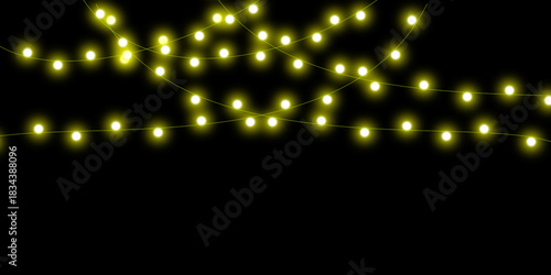 Glowing yellow string lights hanging in two rows against a dark black background creating a festive atmosphere.