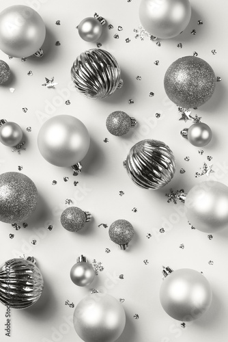 Cloud white Christmas card with dancer and silver balls and confetti, abstract holiday background. Demonstrating color, trend 2026 year.