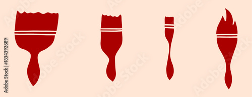Red paintbrushes silhouettes of varying sizes and styles on a light background for artists and painters