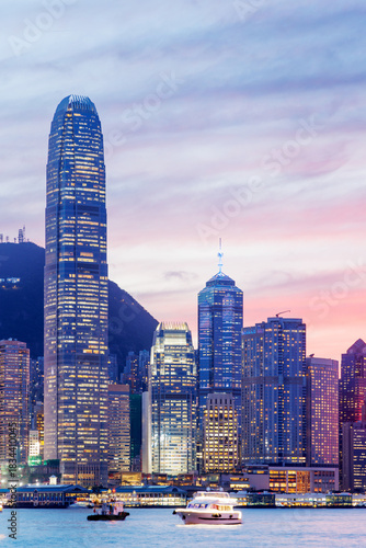 Canvas Print Hong Kong city skyline at sunset with glowing sky and skyscrapers