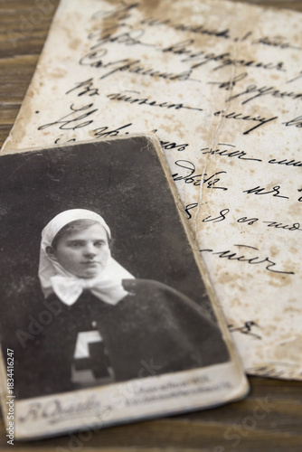 Vintage photo of the hospital nurse 1910s. Part of a letter on the back of a old photo during the 1917 revolution:
