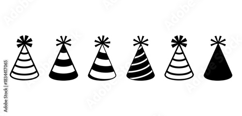 Six diverse party hats with pom-poms on top, some solid black and others striped, arranged in a line for festive celebrations and birthdays.