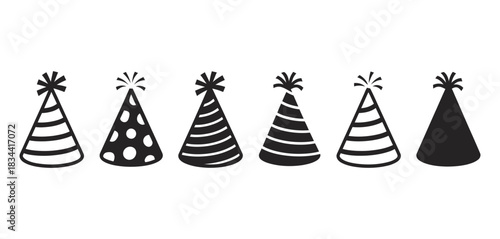 Group of six assorted black and white party hats with different patterns like stripes and polka dots isolated on a white background, festive celebration concept