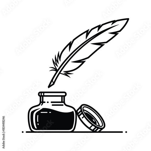 Black inkwell with feather quill pen poised above writing