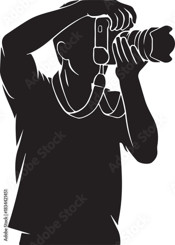 Silhouette of photographer holding camera and taking picture