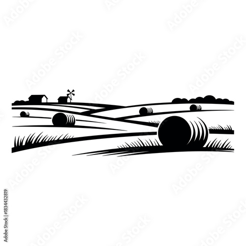 Rural landscape with hay bales and distant farm buildings