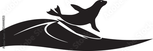 Silhouette of a seal leaping over a wave in the ocean