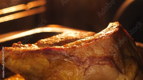close-up of an appetizing piece of meat baking in the oven, fat oozing, concept of preparing a meat dish, roasting pork or beef
