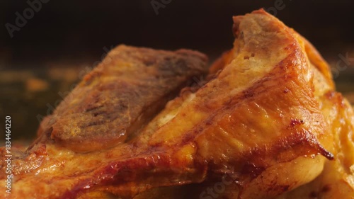 macro of fork checking the readiness of an appetizing prepared piece of meat in the kitchen, tasting and preparing bacon