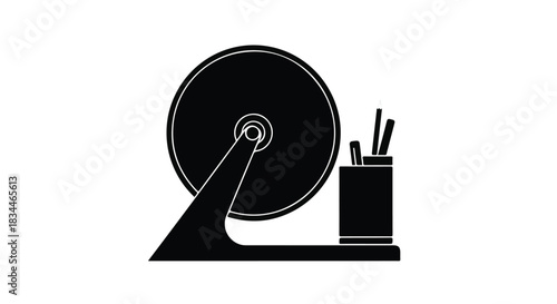 Spinning raffle drum with prize entries and pens for drawing winners