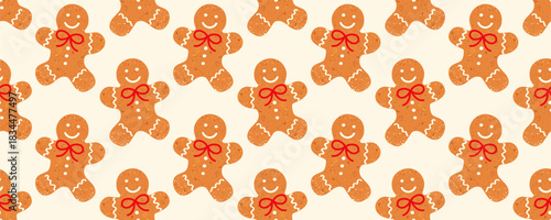 Cute gingerbread men seamless pattern with red bows. Gingerbread cookies