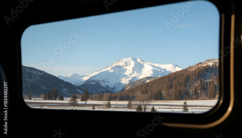 View of a winter alpine mountain through the window of a campervan, Dreamy. White tone