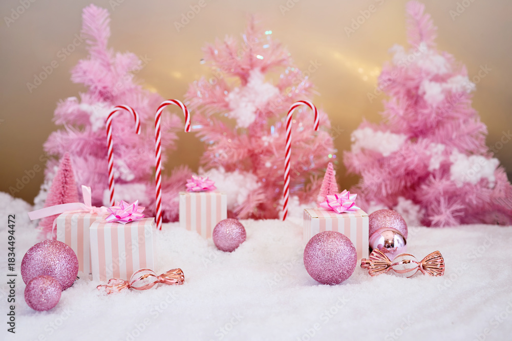Fototapeta premium Pink Winter Wonderland. Festive pink Christmas scene with candy canes, gifts