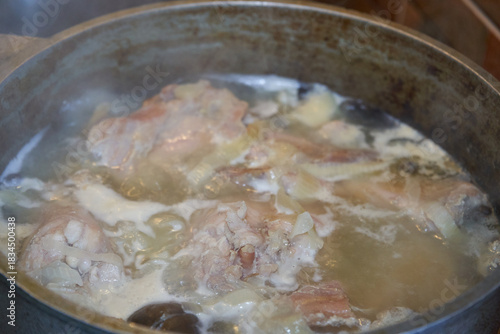 Photography Pieces of meat boil in broth, Preparation of meat broth or soup in a large metal